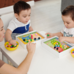 A mother plays with a hands-on game with her two children while practicing their French.