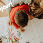 Parent and child learning French together at home using a play-based French homeschool curriculum